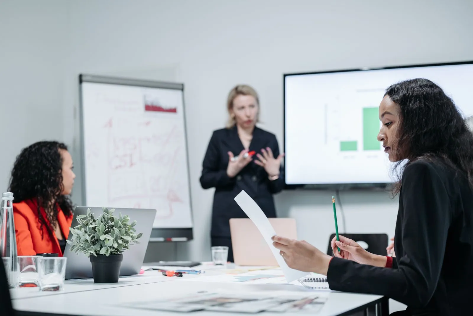 Colleagues reviewing documents together in a meeting room